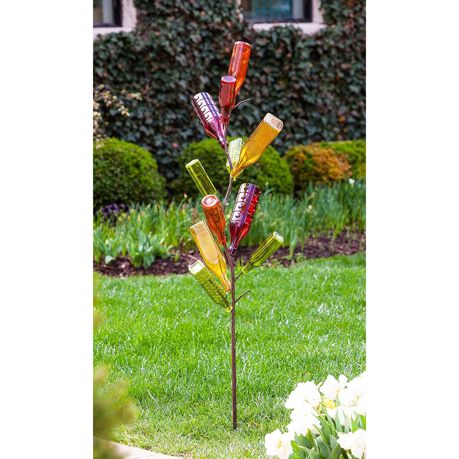 Evergreen Family Products bottle tree lit at night showing added ambiance for outdoor events