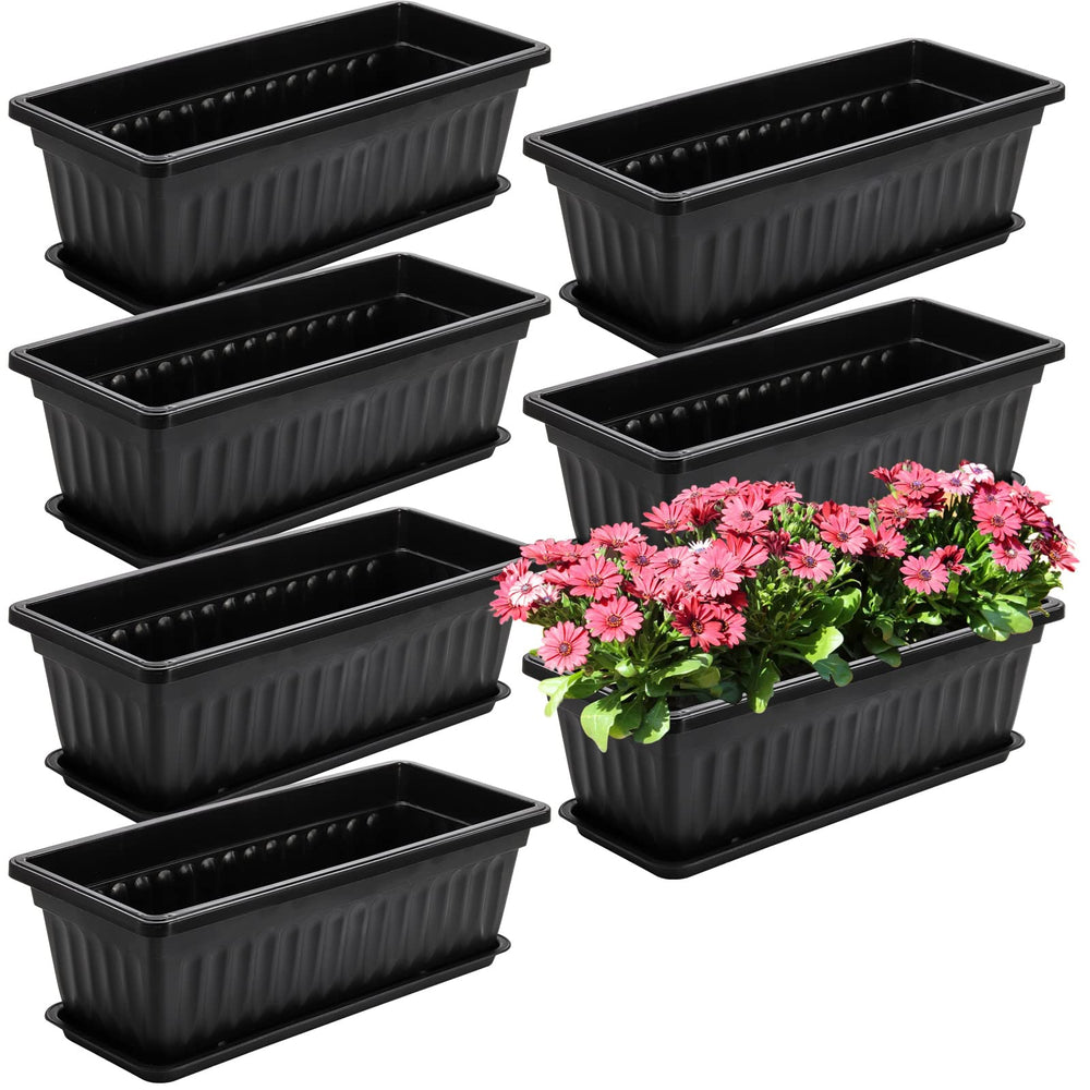 Fasmov front view of seven black window boxes protecting balcony surfaces