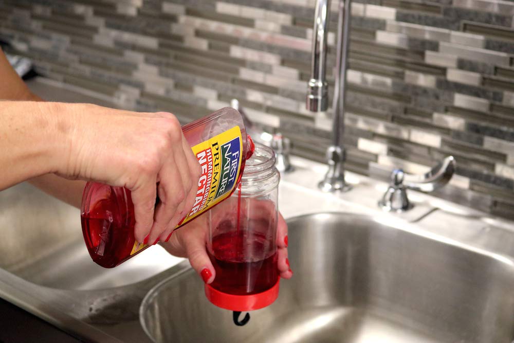 FIRST NATURE concentrate being mixed with water, demonstrates fast, mess-free preparation