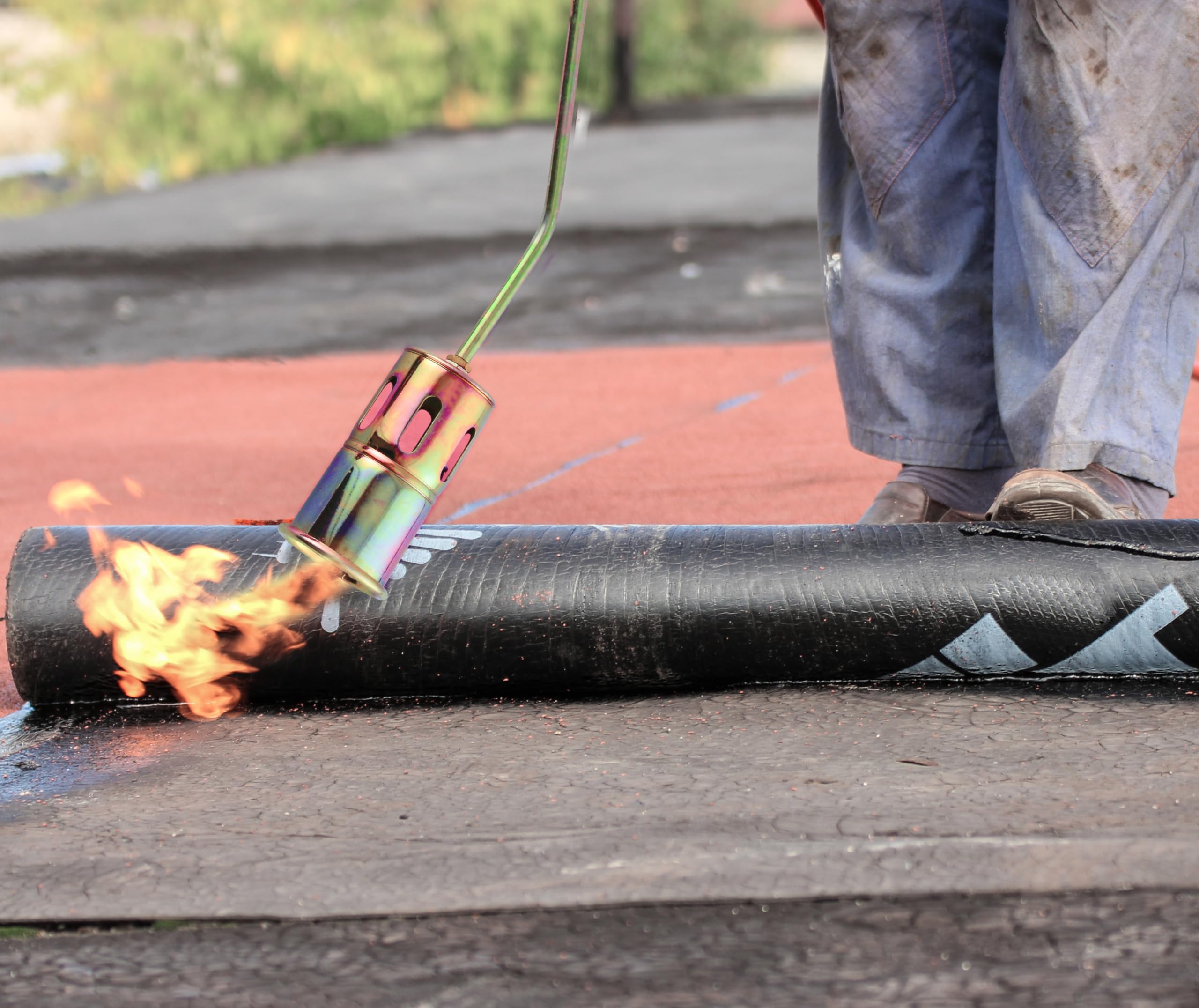 Flame King operator wearing goggles using torch for safe field use