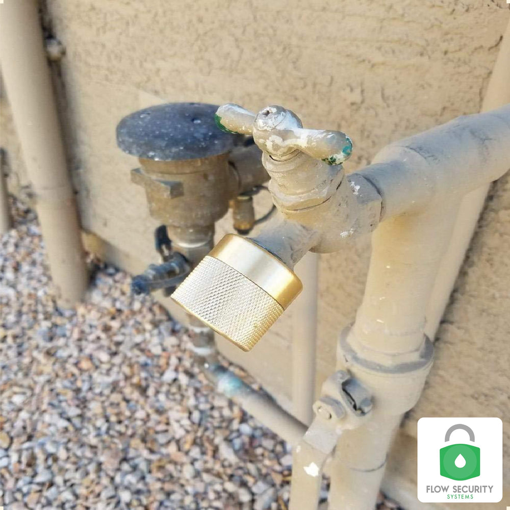 Flow Security Systems next to ruler to show compact size and installation fit