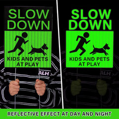 Fumete sign placed by driveway illustrating driver awareness and safer yard