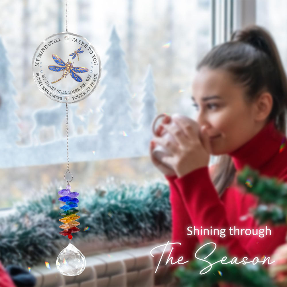 GIFTELIX ornament hanging in window capturing natural light and peaceful remembrance