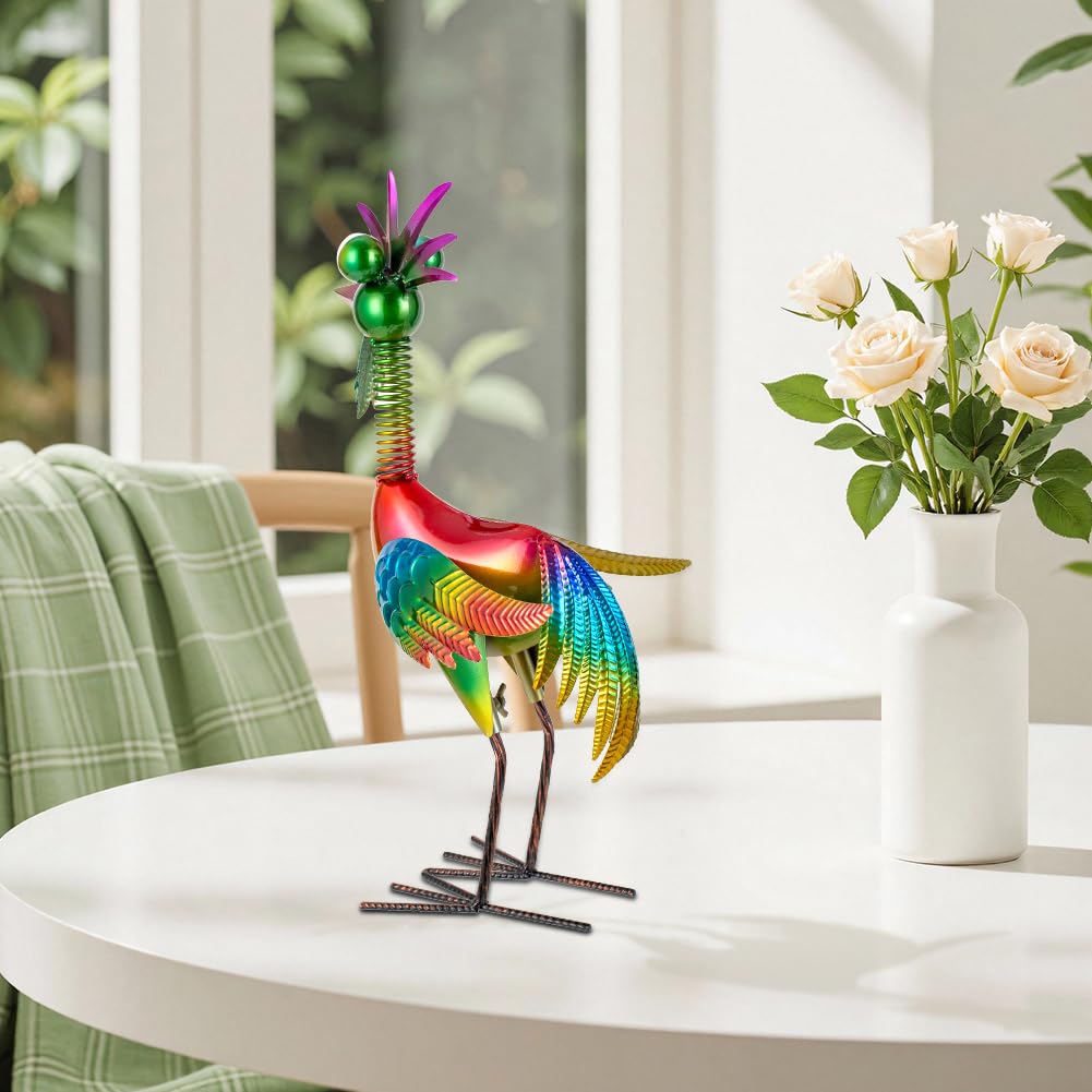giole rooster placed in flower bed providing contrasting garden color
