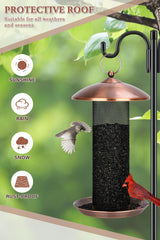 Gtongoko feeder in use with goldfinch clinging and feeding to attract small birds