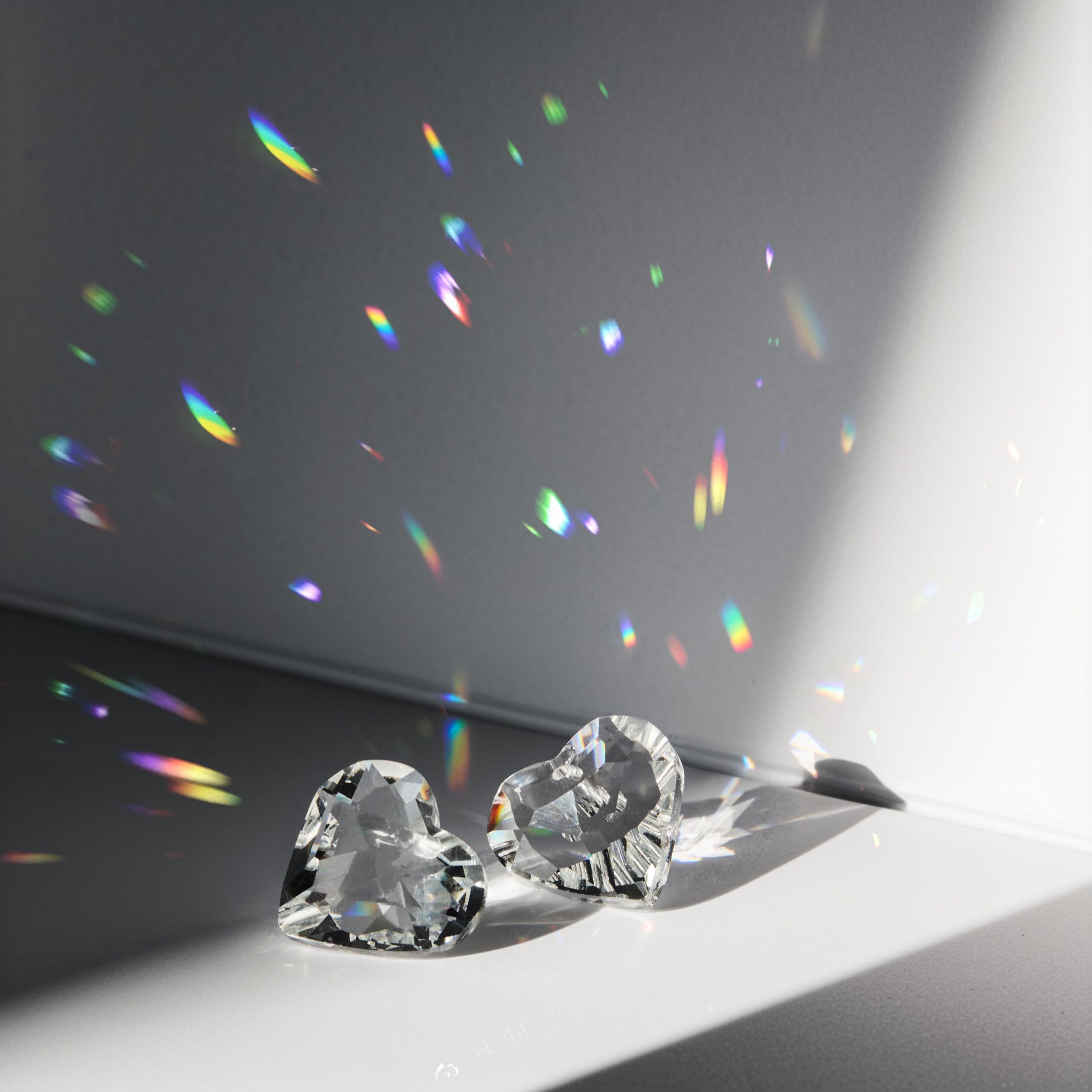 HDCRYSTALGIFTS on car rearview mirror creating small colorful reflections