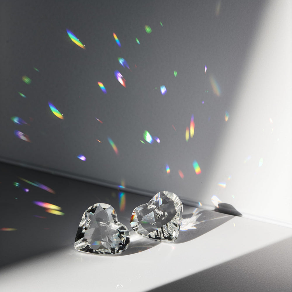 HDCRYSTALGIFTS on car rearview mirror creating small colorful reflections