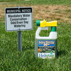 Applying Hydretain across turf with sprayer to reduce watering frequency