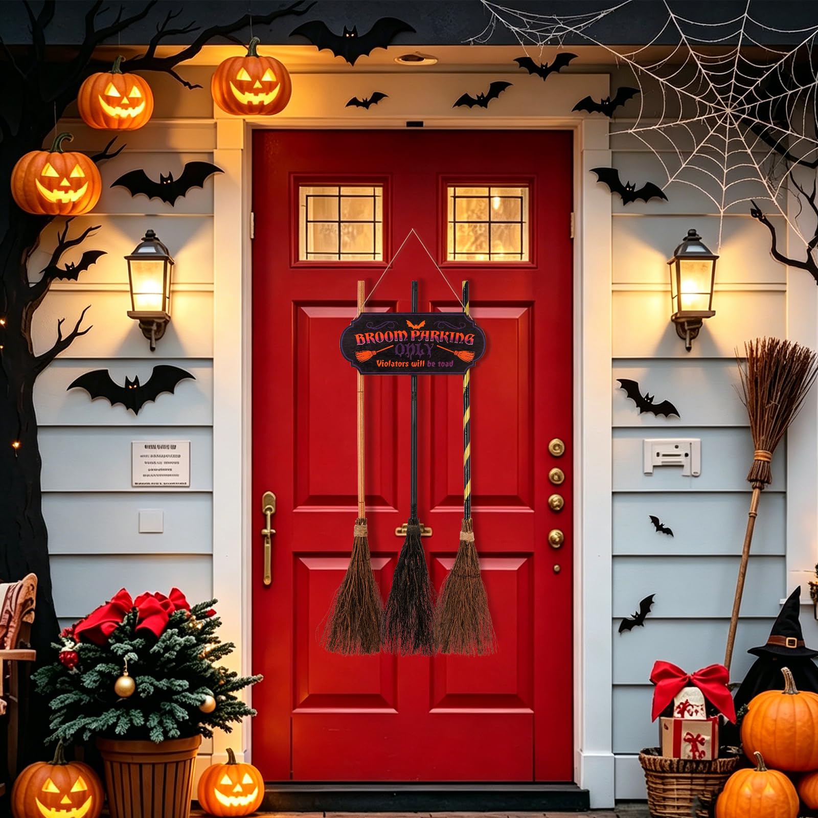Iheqard porch display with brooms and sign creating festive scene
