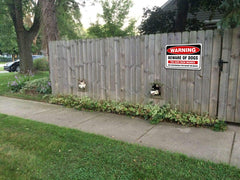 JW Signs on a door with scale comparison showing compact 10x7 inch size advantage