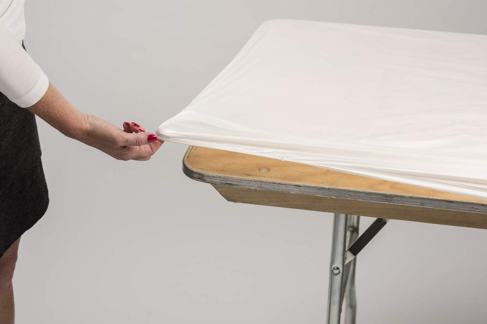 Kwik-Covers on an outdoor event table, tidy surface and wind-resistant benefit