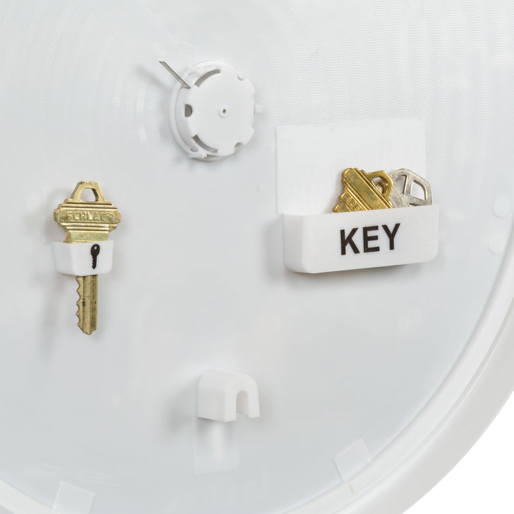 La Crosse Technology open hidden key compartment demonstrating secure spare key storage