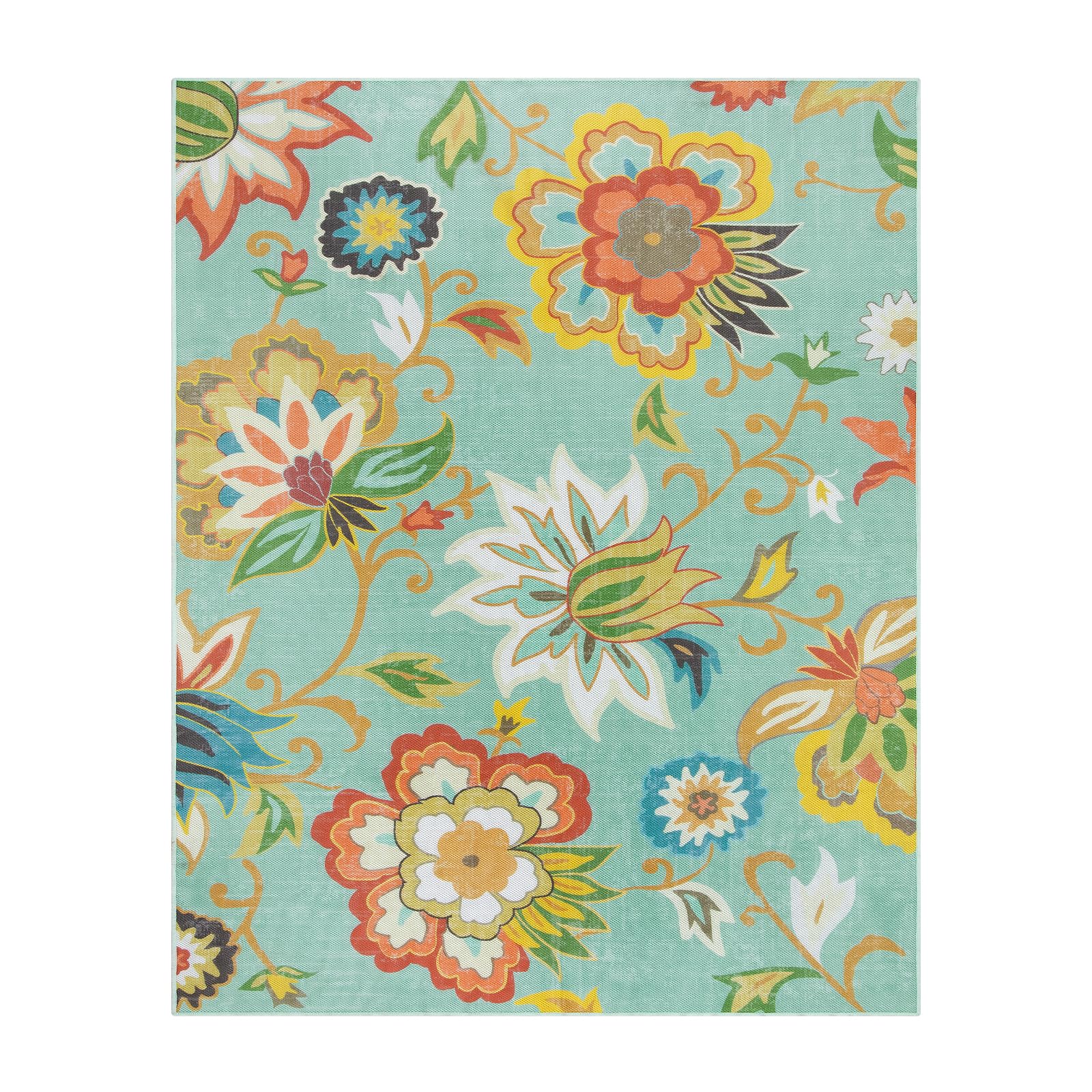 Lahome floral rug next to chair showing 8x10 scale and coverage