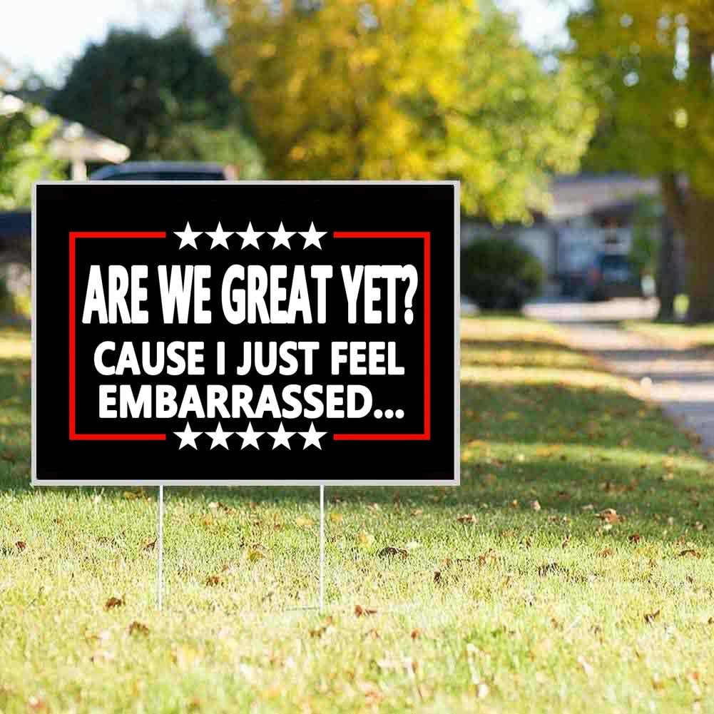 Limecute sign placed in lawn beside flowers highlighting bold outdoor statement