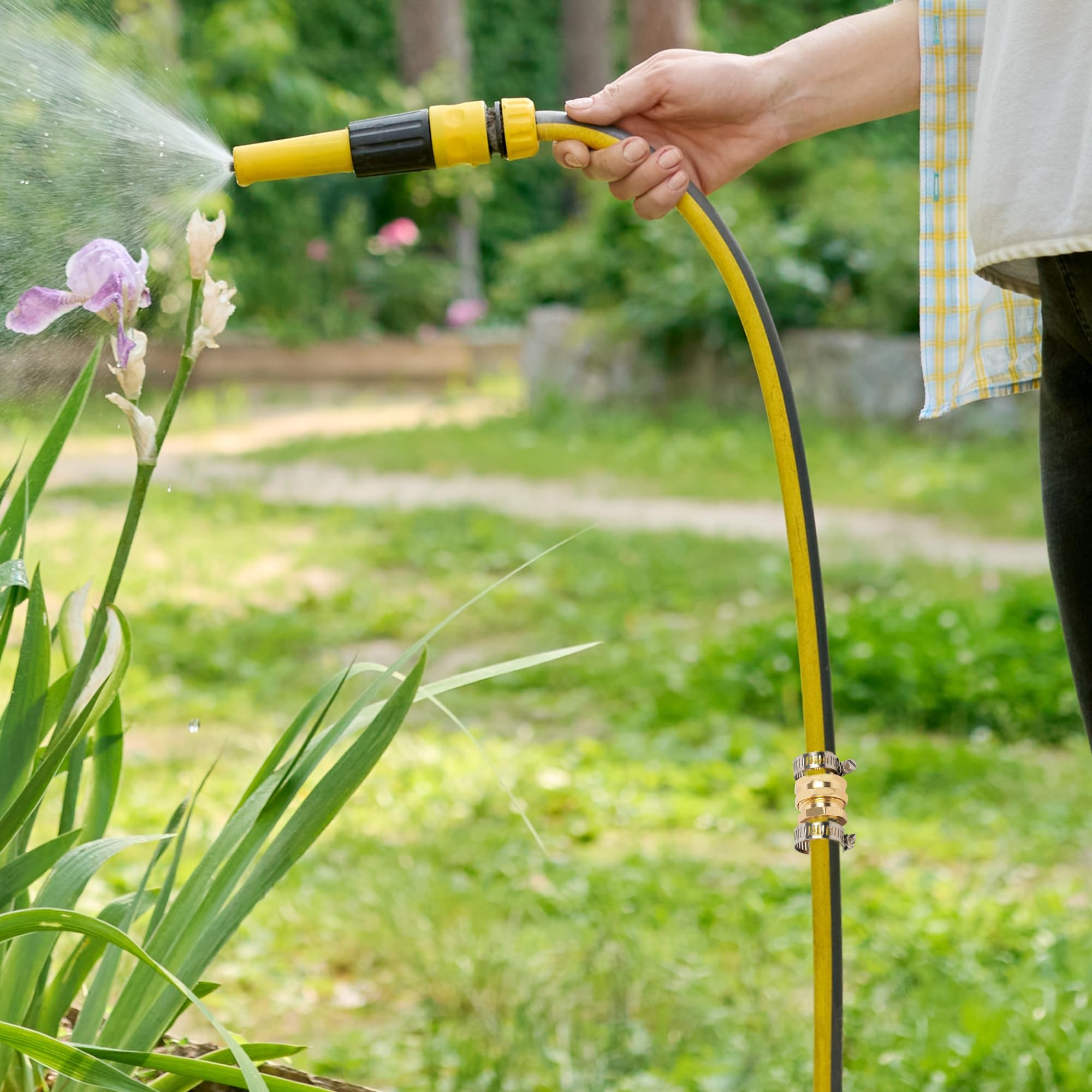 LIULO TOOL installed on garden sprinkler in yard showing convenient watering setup