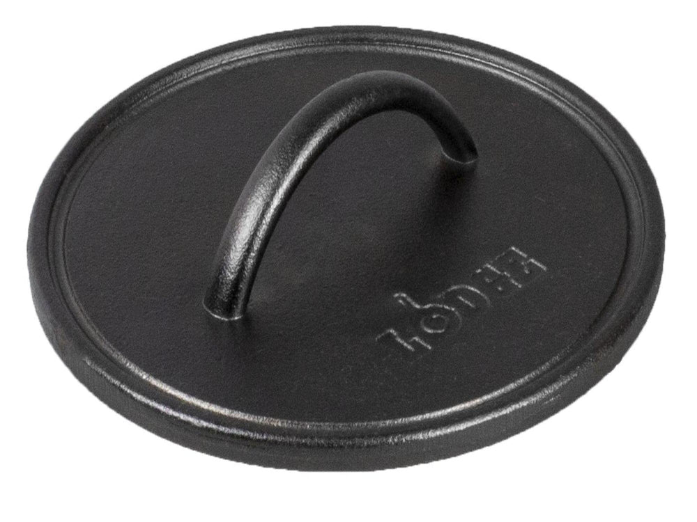 Lodge cast iron press front view showing solid build and easy seasoning benefit