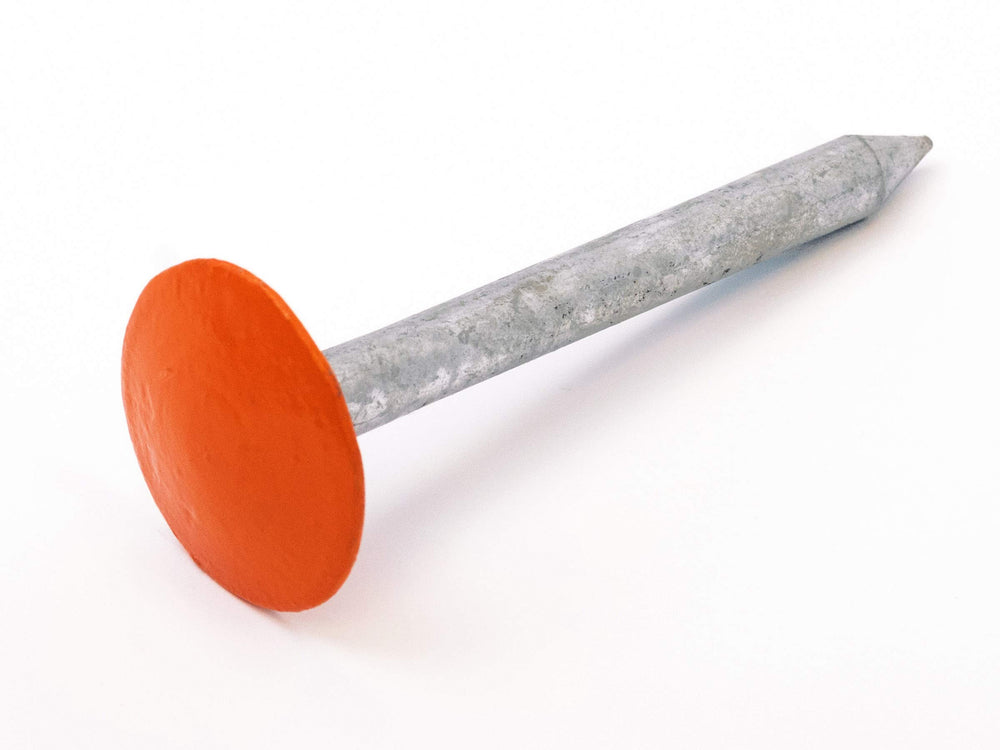 LOW PROFILE SURVEY STAKE size comparison next to foot shows compact scale benefit