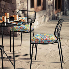 LVTXIII cushion tied to wicker chair on patio preventing slipping