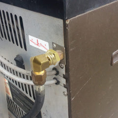 MENSI elbow installed on a grill hose illustrating space-saving connection
