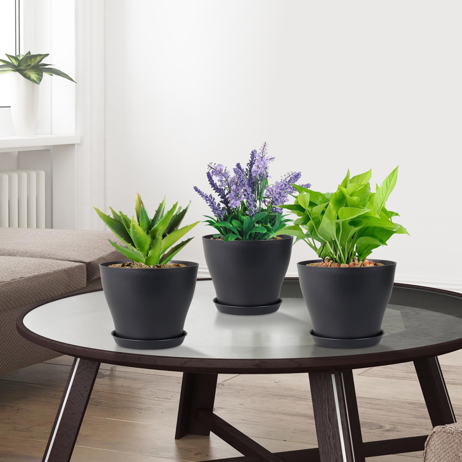 Meowell grouped pots on a windowsill with plants creating a tidy display