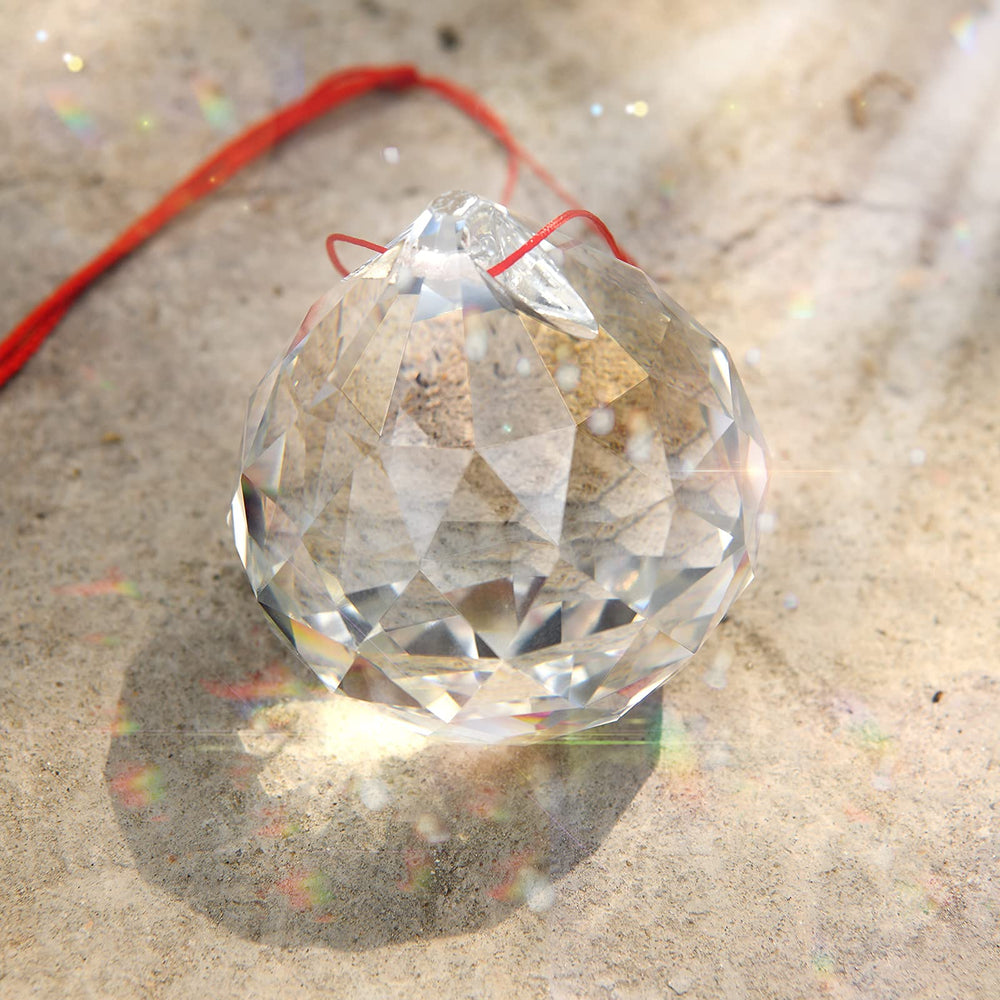 MerryNine front view of 60mm prism ball showing clarity and red cord, enhances room light