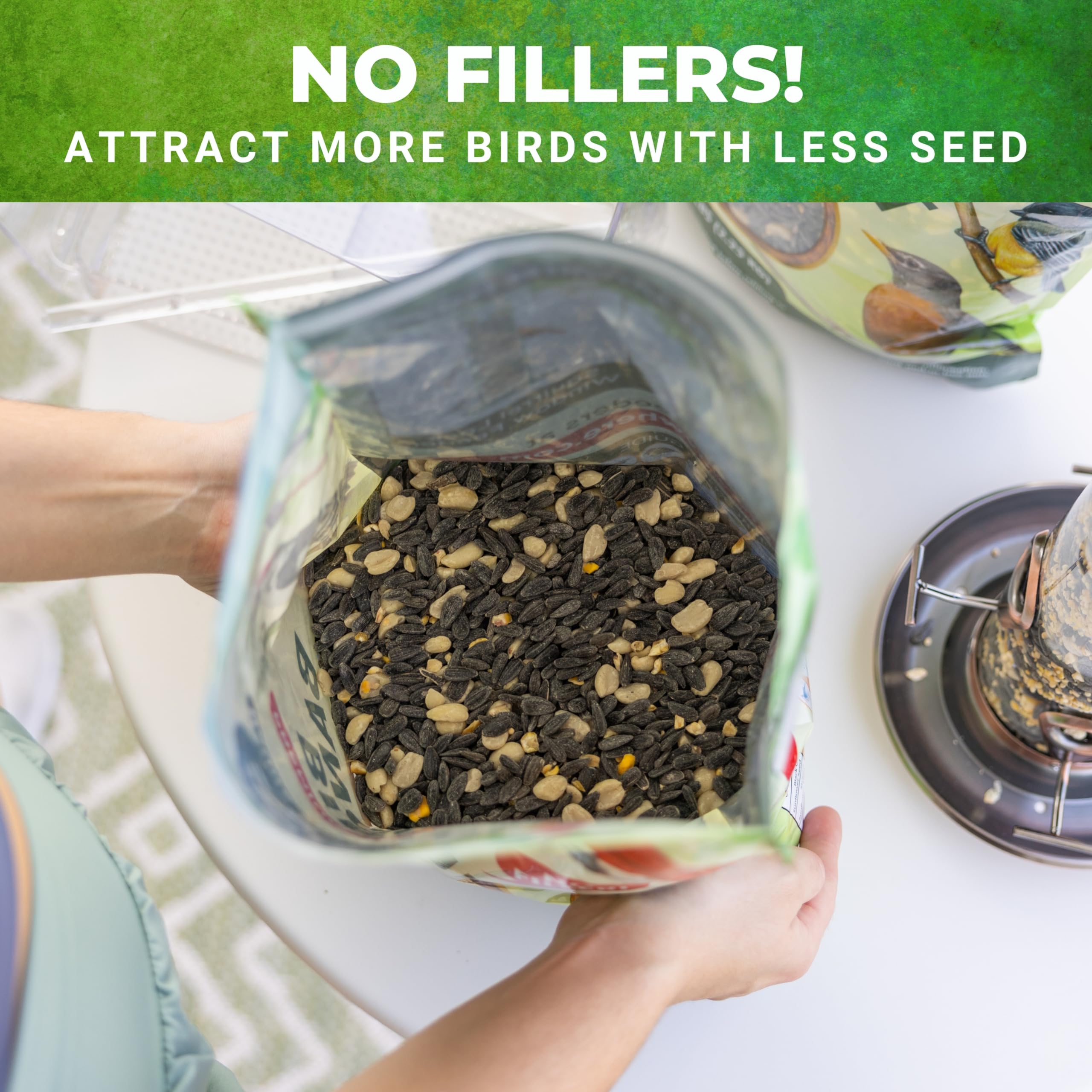 Nature Anywhere seed pouring into a hopper feeder, supports easy feeding