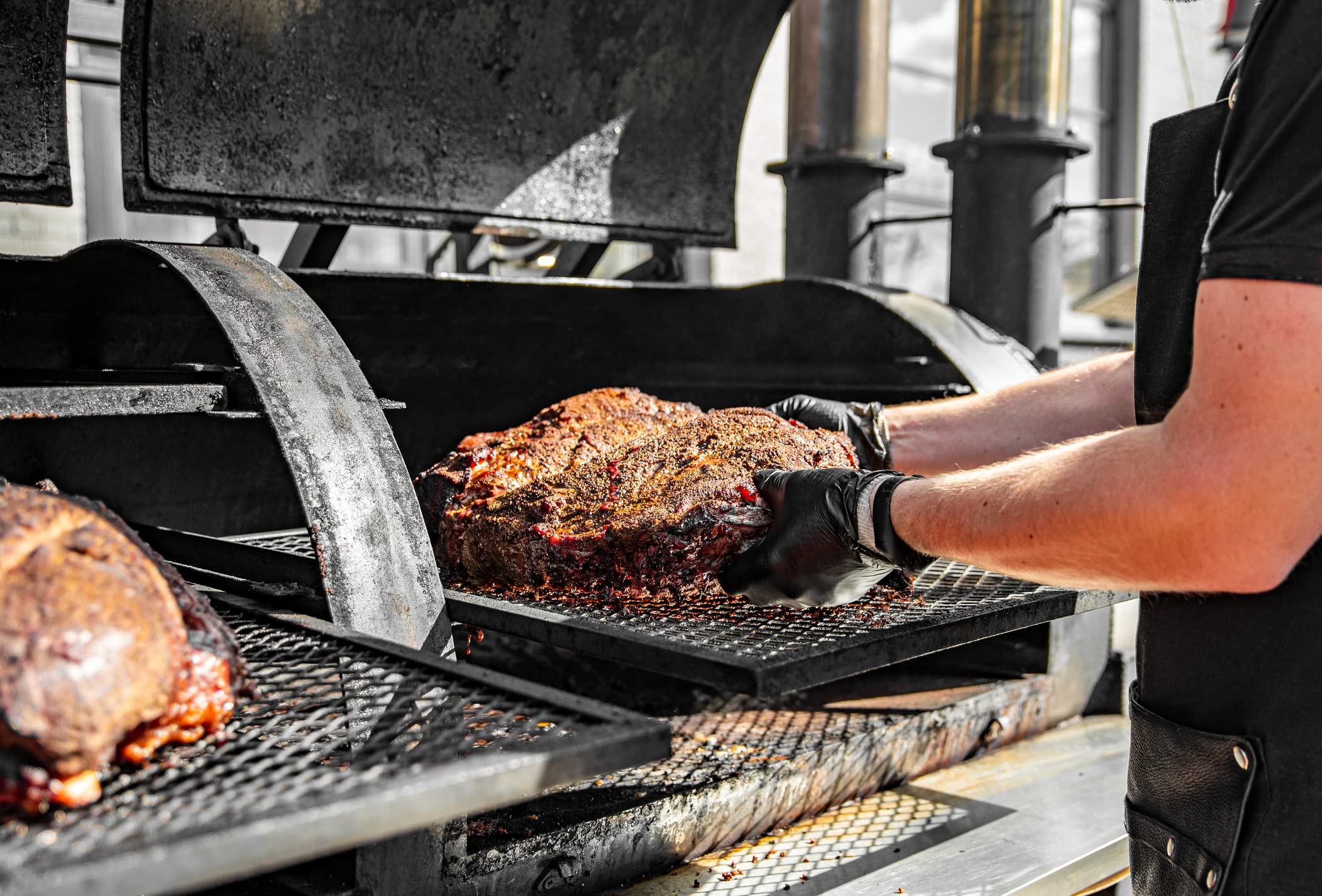 Nechtik lifestyle backyard barbecue scene showing professional-looking food service