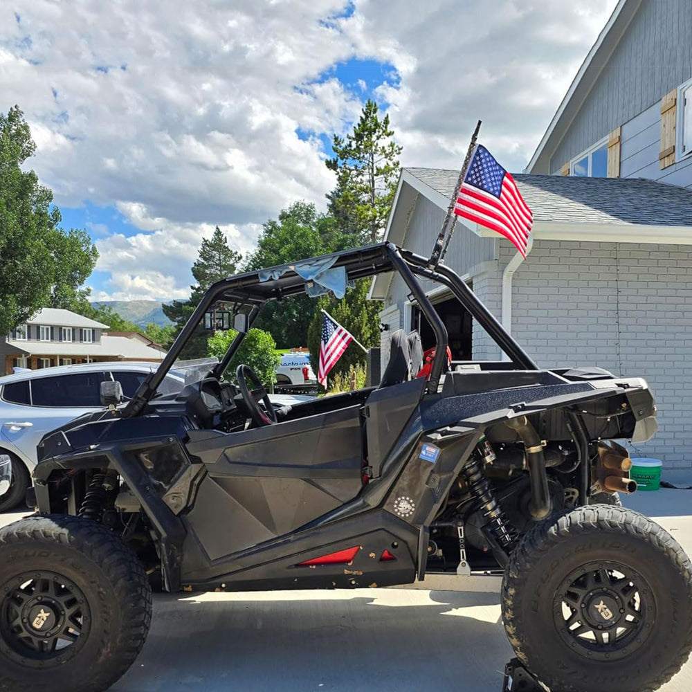 NVSDFAVUZUQ flag displayed in a garden highlighting patriotic curb appeal