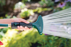 Orbit 58297N in use watering flower bed delivering gentle rain-like spray for seedlings