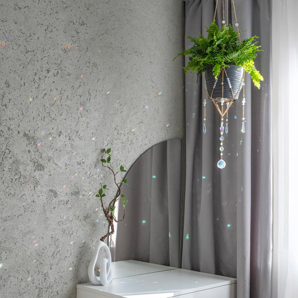 ORCHID AURA hanger held by hands to show size and scale
