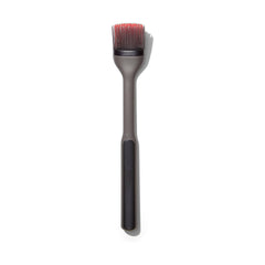 OXO front view of brush with angled head showing elevated bristles for cleaner countertops
