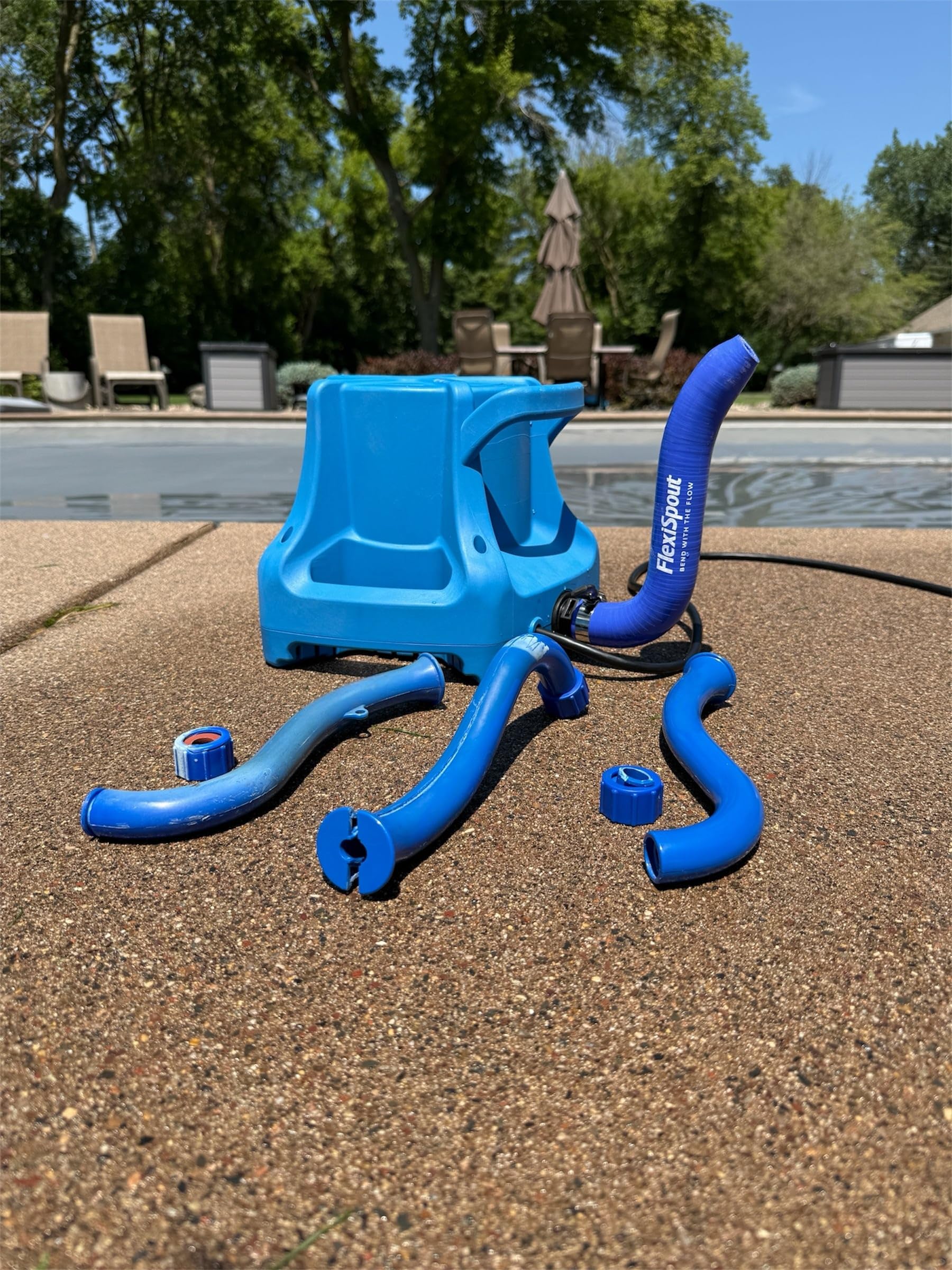 Push Industries FlexiSpout lifestyle poolside winter scene showing freeze-resistant reliability