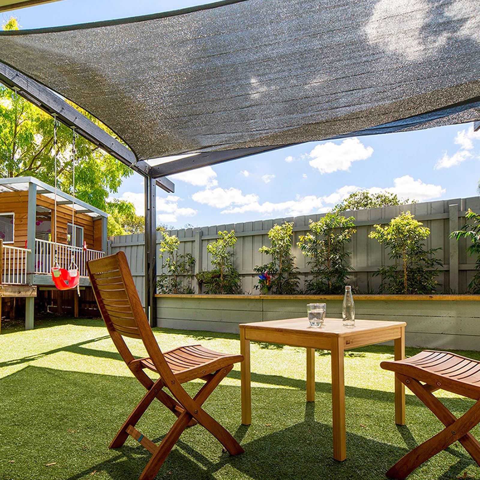 Quobiad shade cloth draped over patio creating comfortable, cooler outdoor space