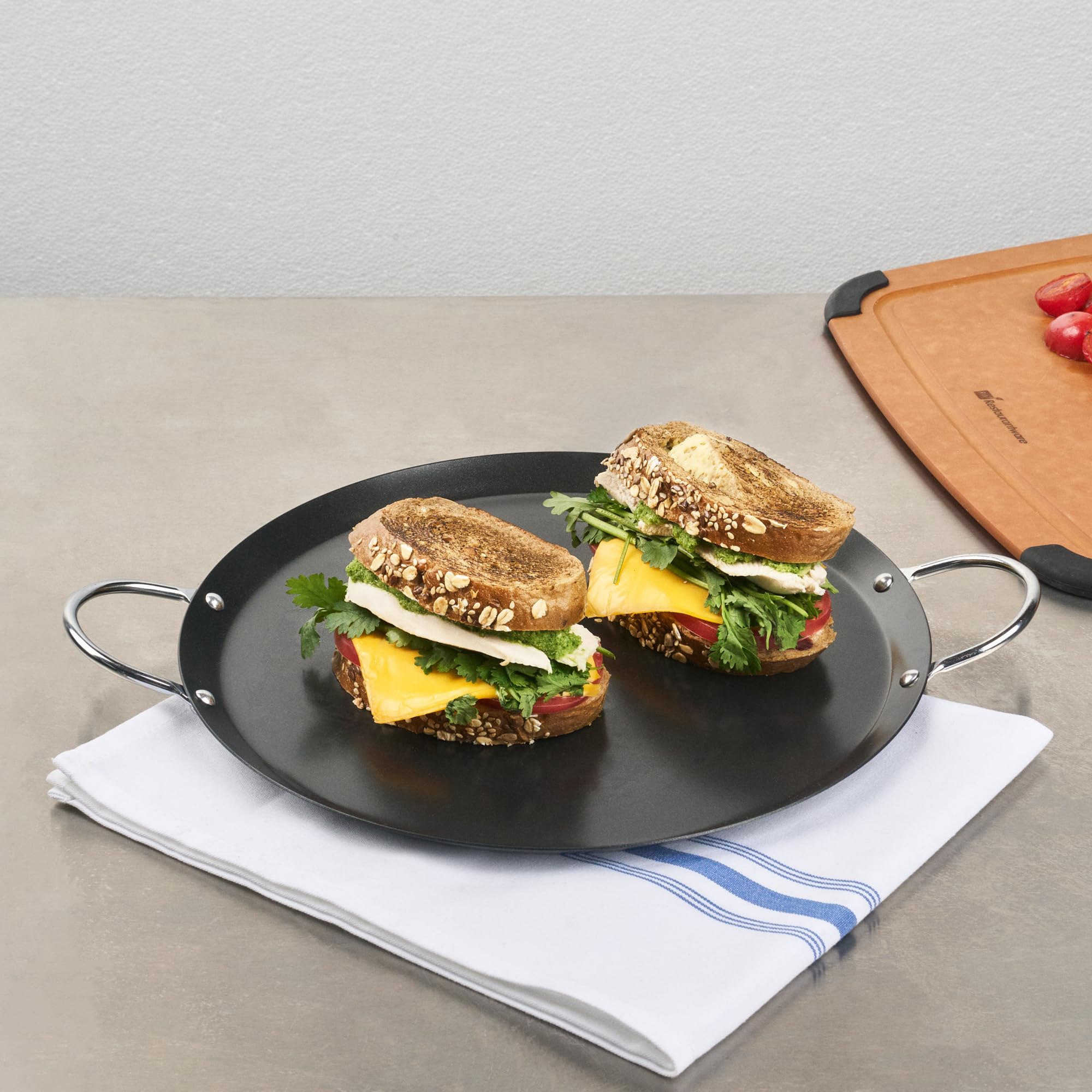 Restaurantware comal being wiped clean to show easy maintenance and simple care