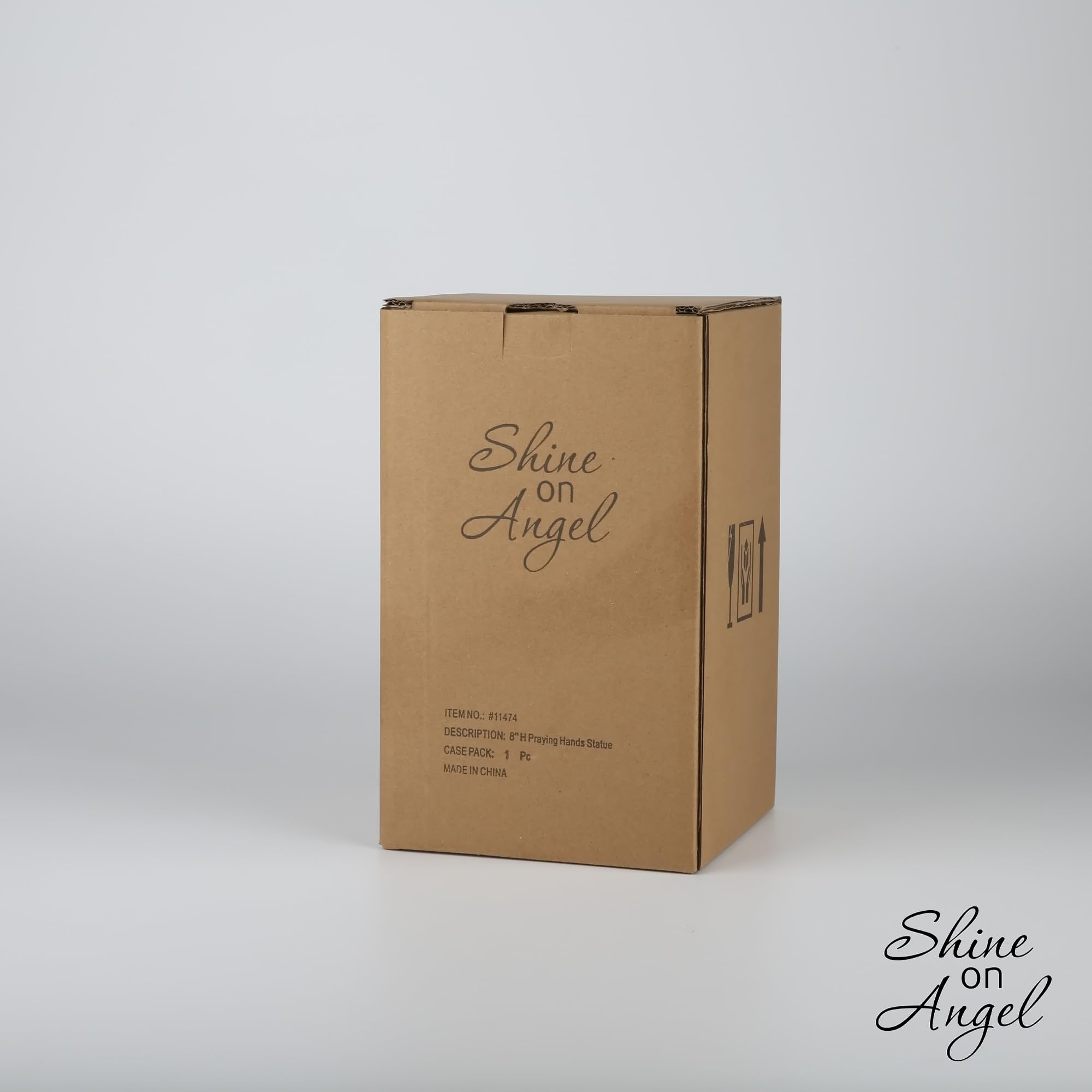 ShineOnAngel installed in a flowerbed showing outdoor durability benefit: weather-ready memorial