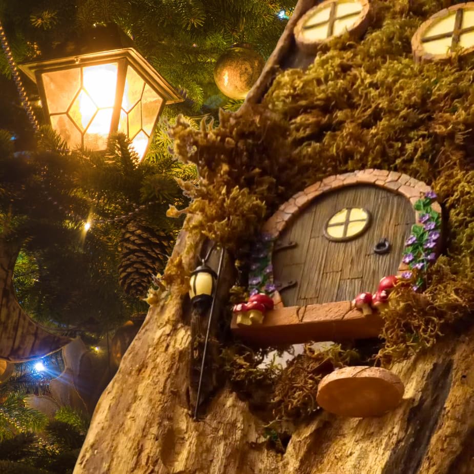 Simple Creativity fairy door glowing at night in miniature garden setting