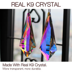 stino prisms hanging in window producing long colorful light streaks