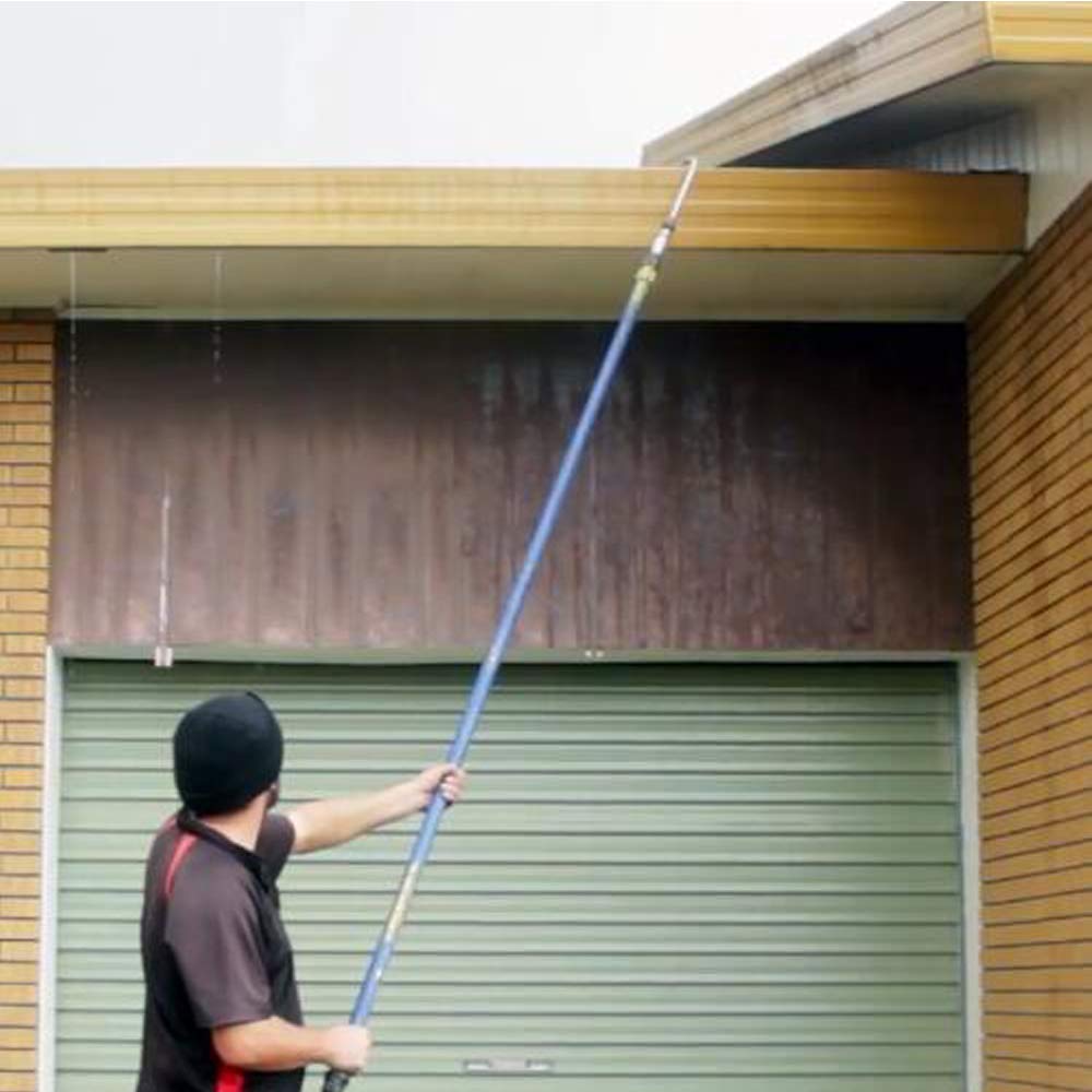 STYDDI attached to telescoping wand showing reach and scale for high areas benefit