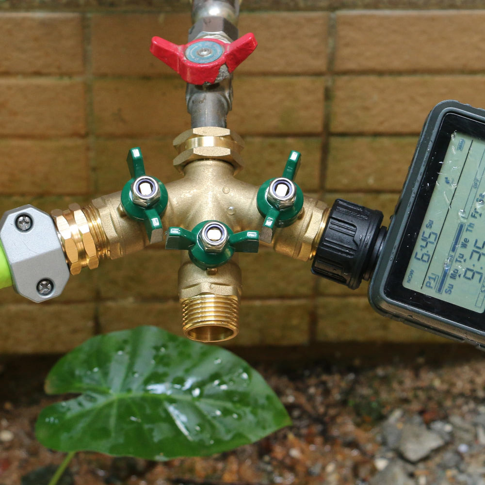 STYDDI next to outdoor faucet showing compact size and easy mounting benefit