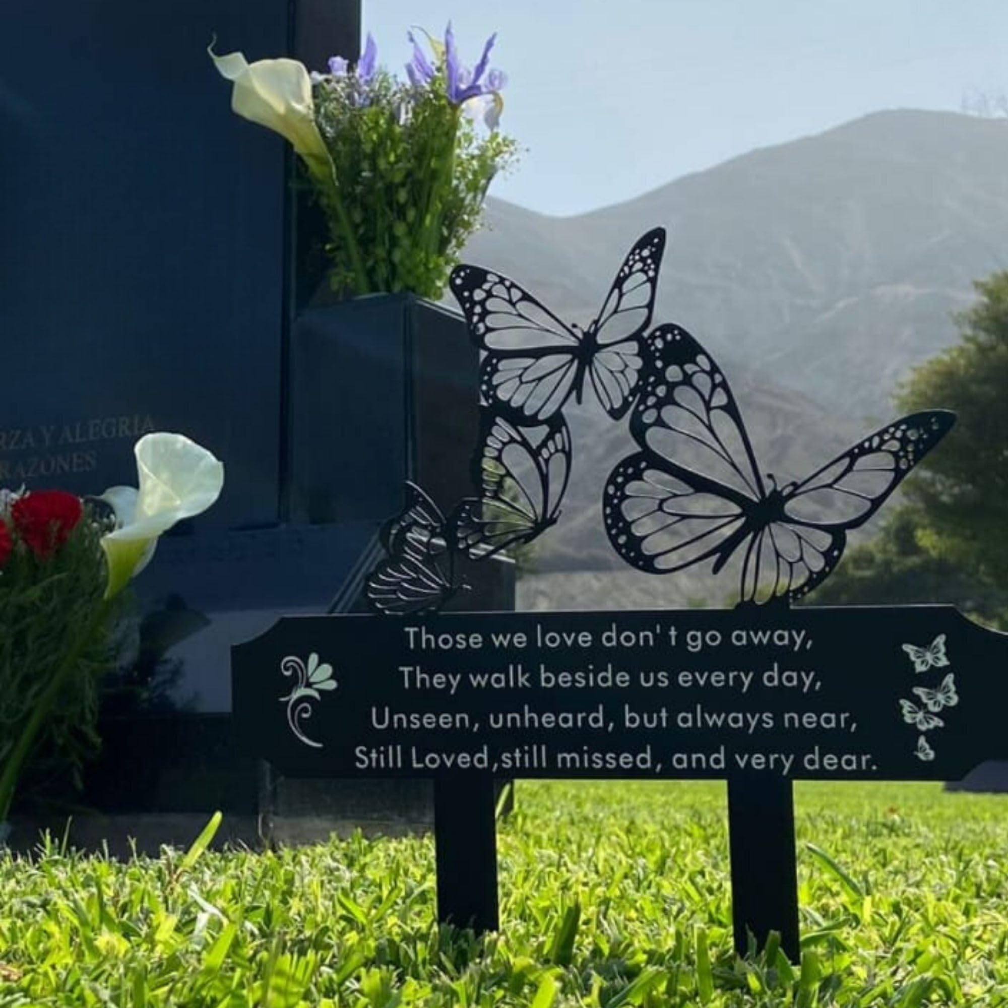 SWEEARTH in a garden setting near plants and stones, creates a tranquil remembrance spot