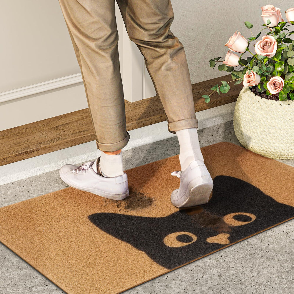 UINI mat being shaken to remove dirt illustrating easy cleaning