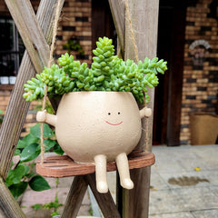 UMESONG side profile smiling face planter displaying facial features and drainage benefit