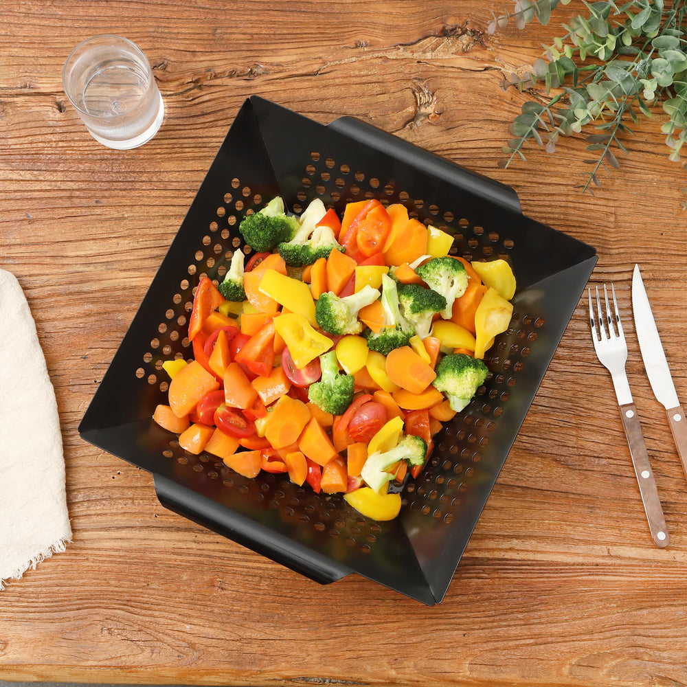 UNCO grill basket being cleaned to show quick cleanup and dishwasher-friendly surface