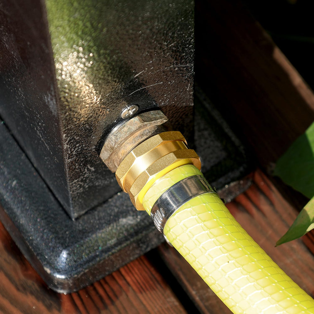 UNWAVER connector attached to sprinkler showing reliable outdoor watering connection