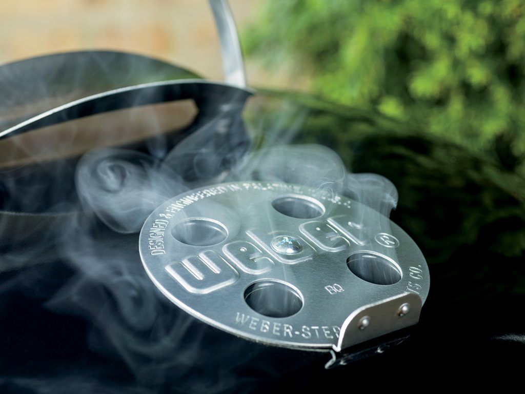 Weber all-weather wheels and sturdy stand visible for easy mobility and stable placement