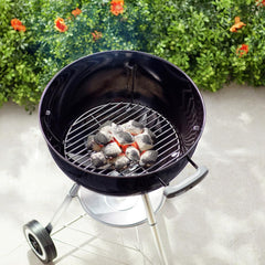 Weber® charcoal cooking grate installed in 18-inch kettle improving airflow