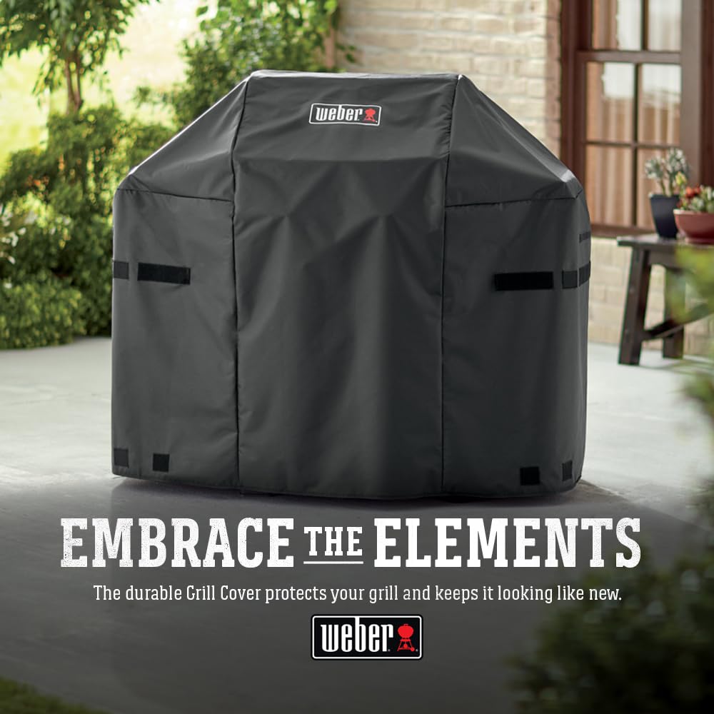 Weber cover on grill in backyard setting for neat outdoor storage