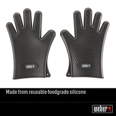 Weber gloves on hands lifting hot grill grate demonstrating heat protection benefit