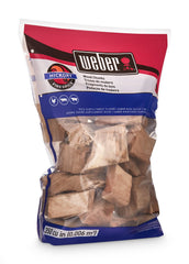 Weber hickory chunks next to backyard smoker demonstrating convenient use