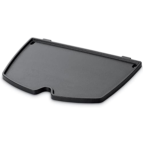 Weber griddle next to spatula and plate showing scale and practical size